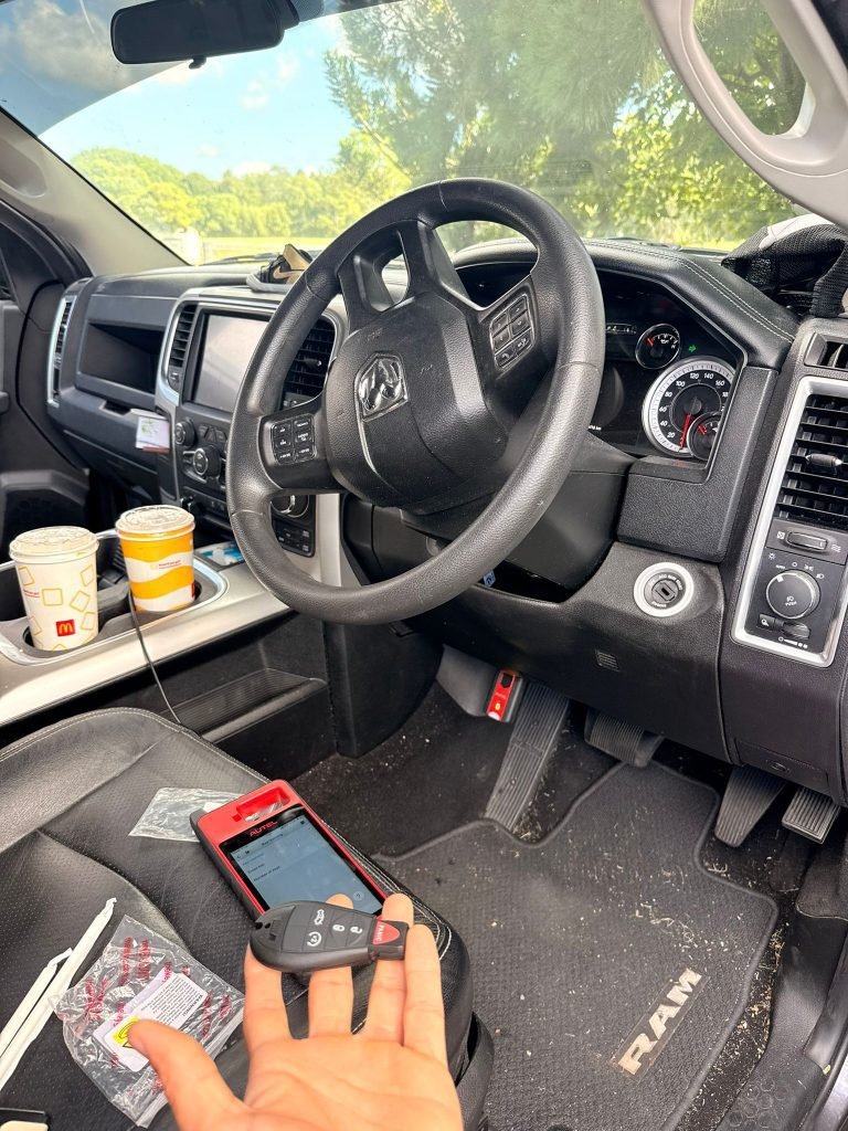 Gold Coast locksmith programming a replacement car key on-site after keys lost