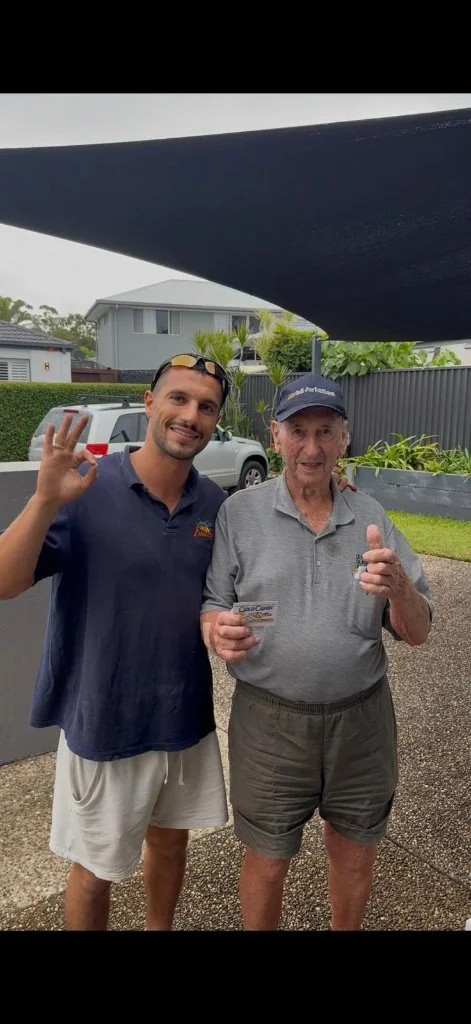 Pensioner customer showing concession card for 10% locksmith discount on the Gold Coast