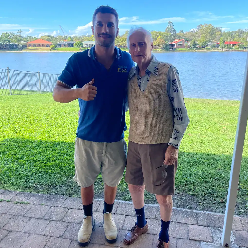 GC Fast Locksmith handing keys back to an elderly customer after a home lockout on the Gold Coast